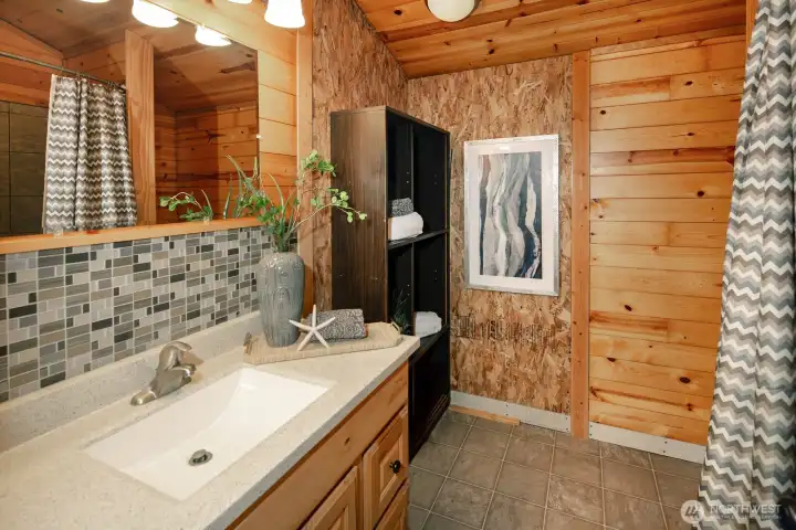 Primary Bath with deep tub behind the curtain
