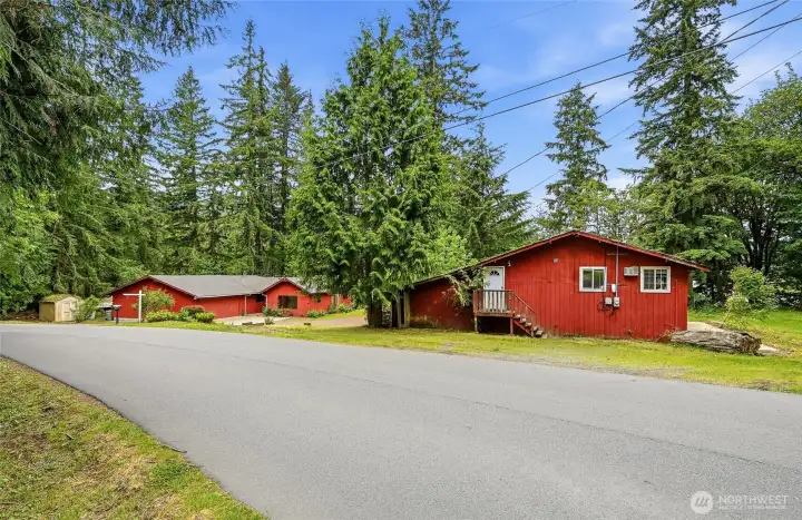 Primary home in Distance and entrance to the office on 2nd level of the Barn.