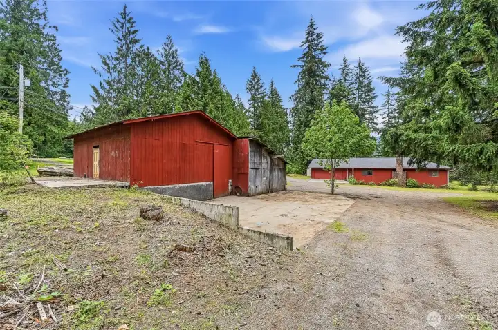 Parking Pad next to Barn primary home in distance