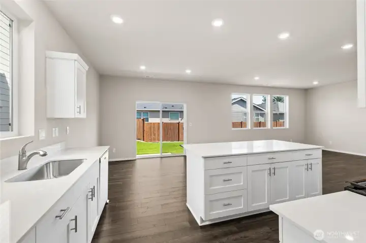 Overlooking kitchen island and kitchen layout. Colors & options may vary. Overlooking kitchen island and kitchen layout. Colors & options may vary.