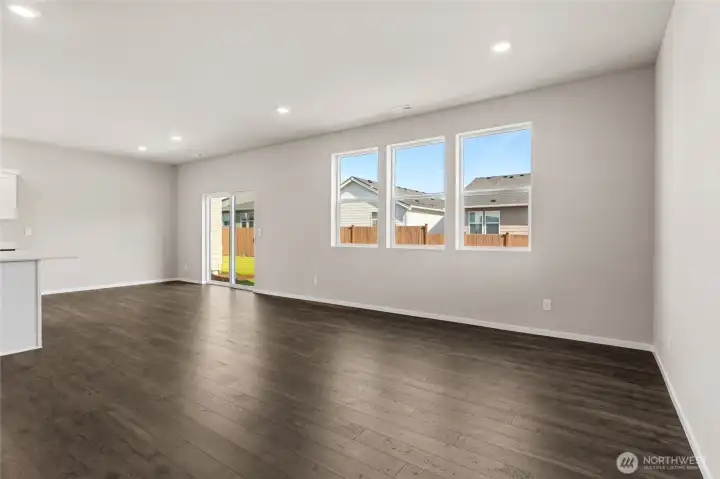 Dining room with transom windows leading into great room. Finishes and options will vary. Dining room with transom windows leading into great room. Finishes and options will vary.