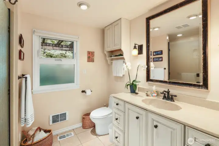 prmary 3/4 bath  linen closet is plumbed for laundry- with w/d currently in place