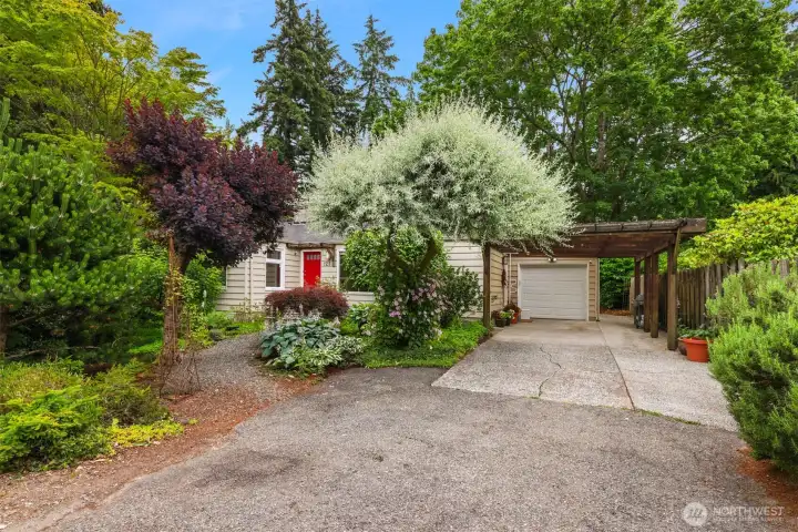 Garage and covered carport with additional parking off street