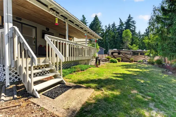 Covered porch leads to the large back yard Covered porch leads to the large back yard