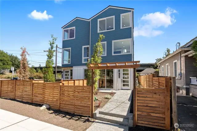 Modern new construction with a striking exterior and fenced yard in Wallingford.