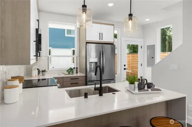 Perfectly designed kitchen with plenty of storage and a modern touch throughout.