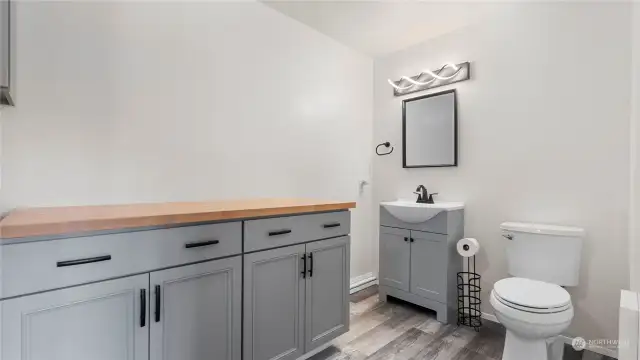 Utility room has a convenient bathroom