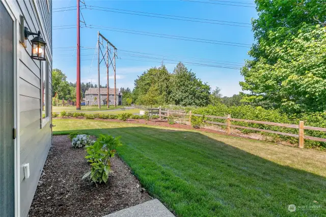 View of the backyard off the kitchen glass sliding door.