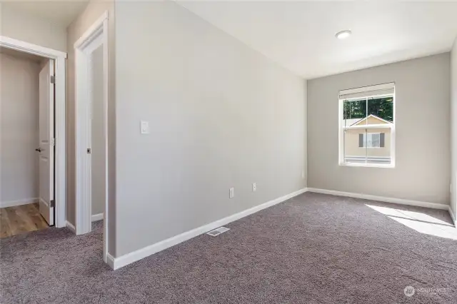 Utility room is slightly to the left and the 3rd bedroom is the door on the right.