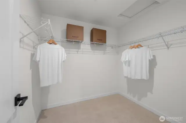 Finally, a closet that gets you. Say goodbye to storage struggles—this walk-in closet has room for it all and then some.