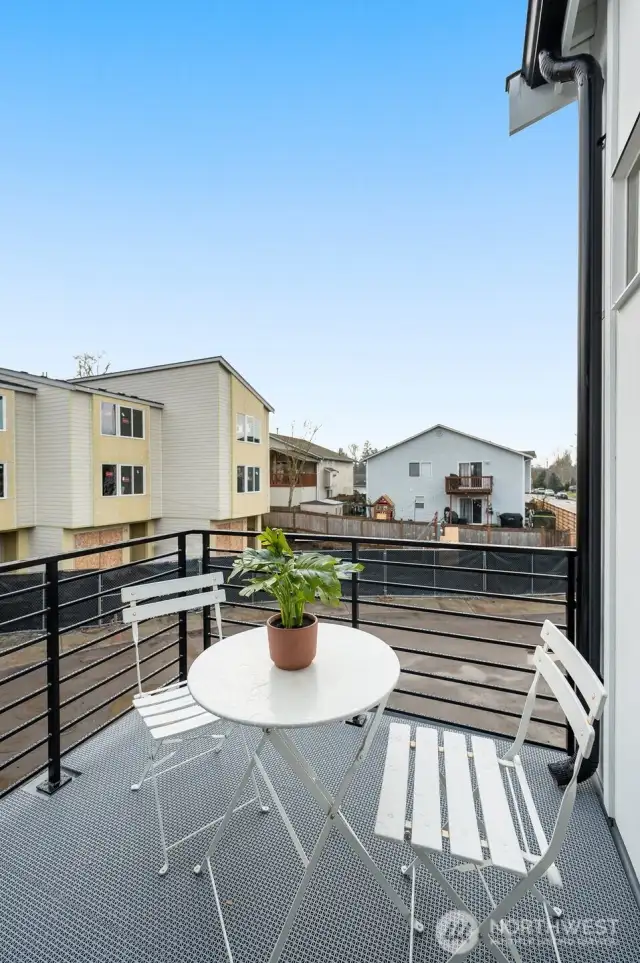 Morning matcha or evening wine? This private balcony off the primary suite is ready for both.