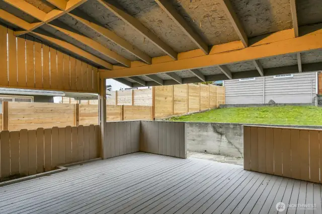 Dining al fresca made easy! This large covered deck is perfect for the PNW and located just off of the kitchen. there are walkways on either side of the house that lead to this space. Birthday party spot!
