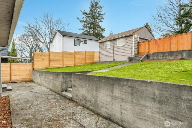 Beyond the new fence, check out the DADU in the neighbor's backyard... you want one too?