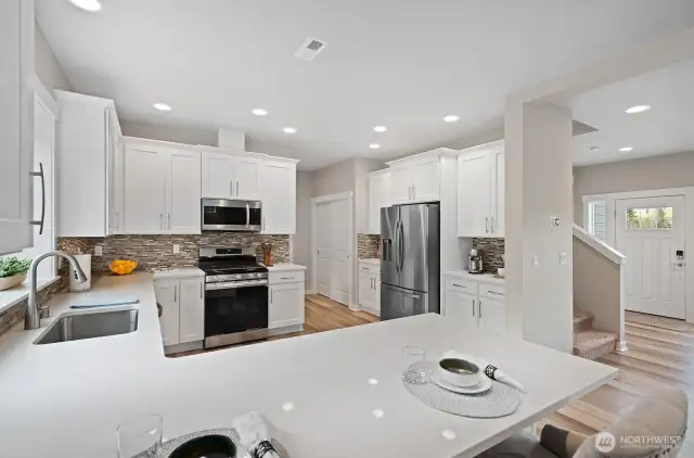 Check out the perfectly placed nooks on each side of the refrigerator. Coffee bar, wine bar and AMPLE kitchen storage!