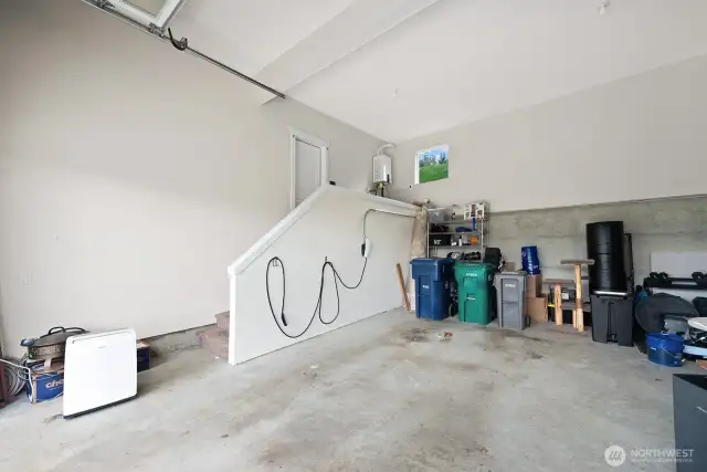 Incredibly over sized two car garage with car charging staion.