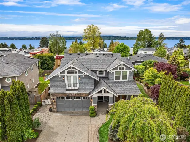 Fabulous 2006-built home in Kirkland's West Houghton neighborhood. Seconds away from beautiful Lake Washington, this 2-story with basement home features 4,410 of finished square feet.  Live on a quiet tree-lined street with easy access to downtown Kirkland, downtown Bellevue and the 520 bridge.