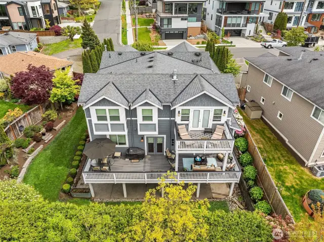 Beautiful multi-level decks with western exposure provide all kinds of options for enjoying the outdoors.  Enjoy views of downtown Seattle from the primary suite's private deck while the expansive deck on the main level offers both covered and uncovered spaces.  Below, the covered patio is easily accessed from the home's fully-finished walk-out basement.