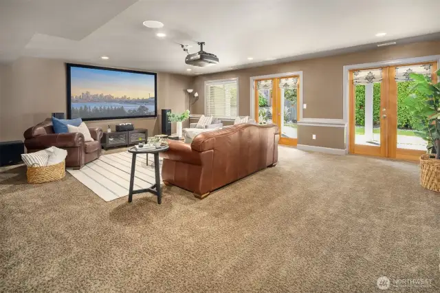 Dark basements can be uncomfortable spaces.  Surely not the case here.  The twin French doors serve a dual function of inviting in the natural light and providing easy access to the private back yard.