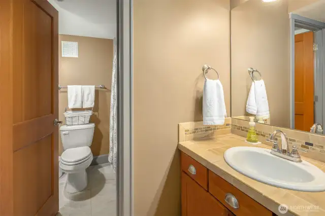 The is the full bathroom that is located just outside of the downstairs bedroom/workout room. Totally private and such a bonus!