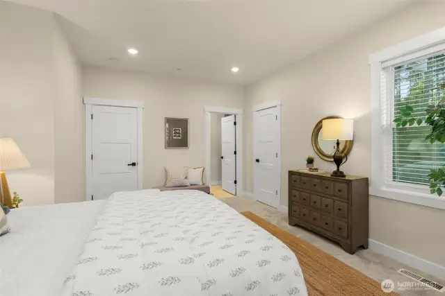Primary bedroom offers dual closets, dual sinks, separate water closet, and walk-in shower.