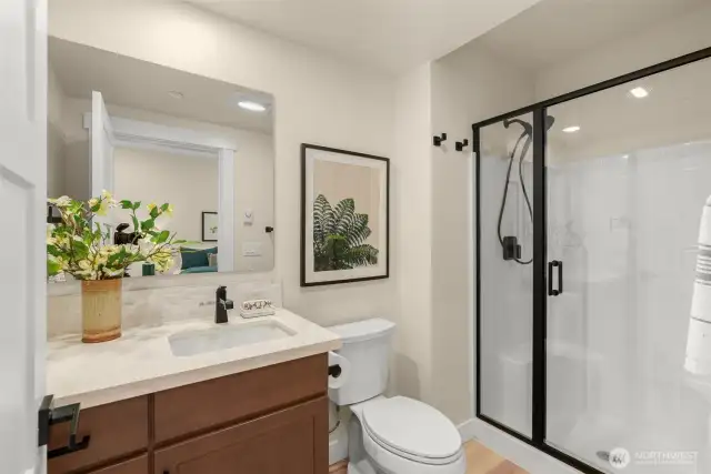 Ensuite 3/4 bath in lower-level bedroom.