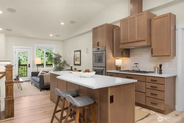 Kitchen features stainless steel Thermador appliances, gas cooking, and lots of quartz countertops.