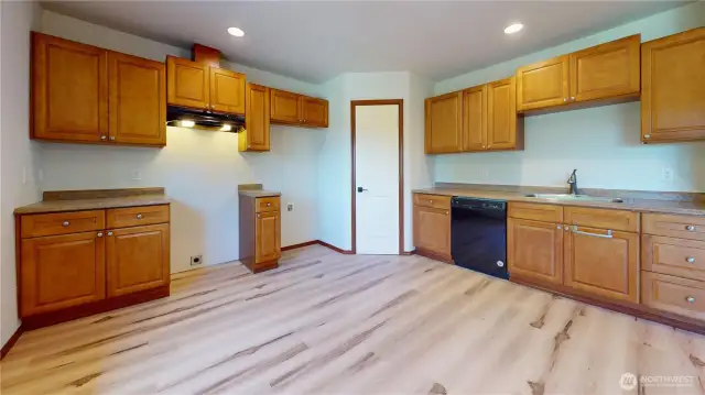 ADU kitchen and dining. New stainless steel range and fridge have been installed since photos.