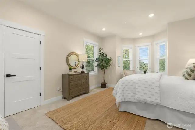 Spacious owner's suite/primary bedroom suite.
