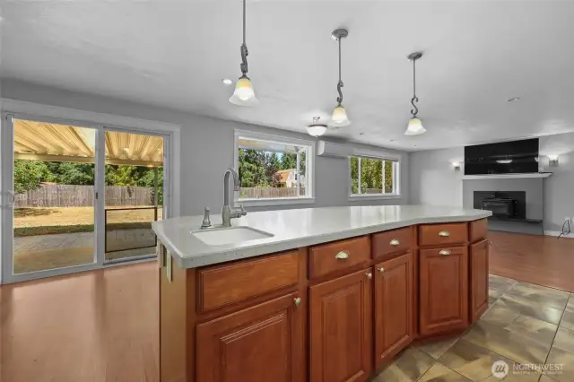 Island offers contrasting cabinets and prep sink--awesome!