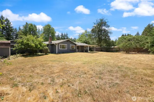 Spacious, level, fully fenced lot has MANY possibilities; hard to find this kind of space and privacy, at this price!