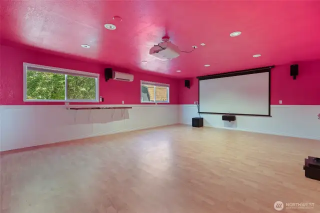 Cool live-edge wood shelves on each wall, several opening windows, and ductless heating/cooling make this room perfectly flexible for whatever your situation may be!