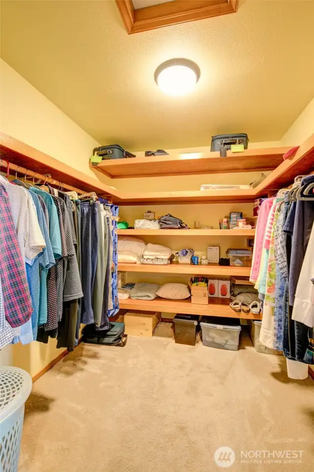 Primary bedroom walk in closet