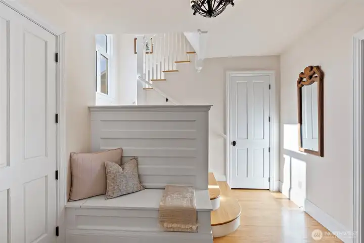 Welcoming front entry and bench with extra storage.