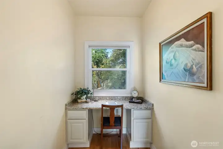 Small office space off of the kitchen with built-in desk - could be easily converted into a pantry to fit your needs.