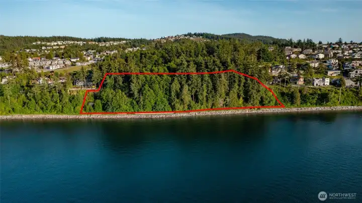 Property viewed from the water. 683' feet of waterfront (Guemes Channel trail is at property line and Guemes Channel beyond).