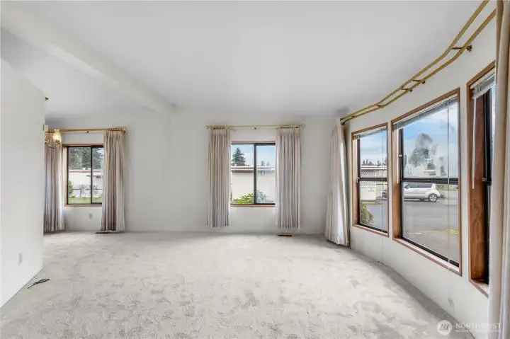 Enter into the light and bright living room. Brand new carpets throughout the home.