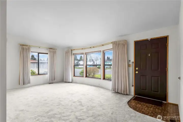 Another view of the living room. All window coverings stay.