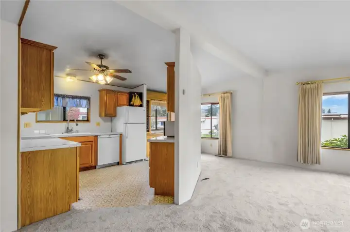 A view of the living room and kitchen areas. A great layout.