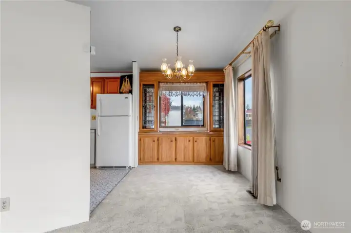 The good sized dining area includes a built in hutch with storage cabinets.