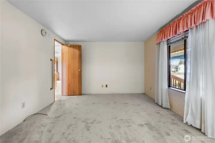 The spacious primary bedroom allows options for furniture layout.