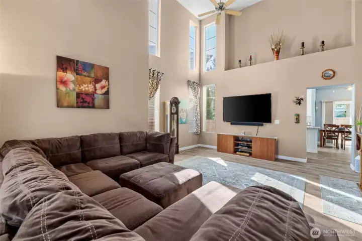 Spacious Room Featuring Tall Ceilings and Abundant Sunlight