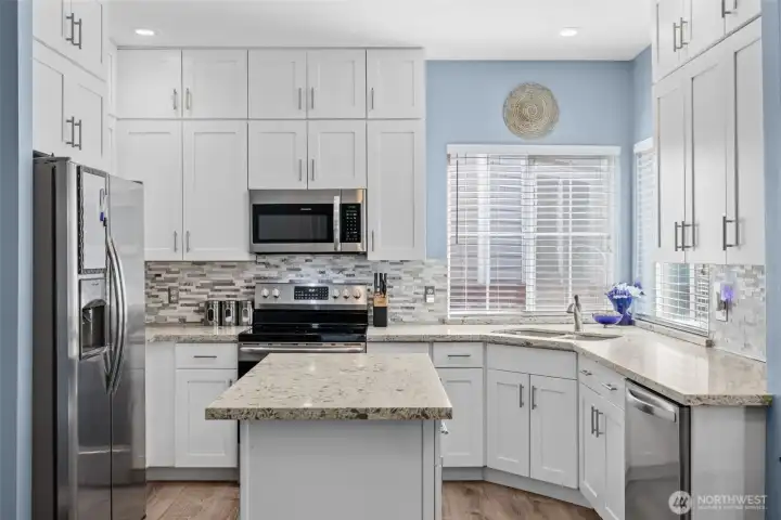 Beautiful Kitchen Designed for Function & Style with Ample Cabinets