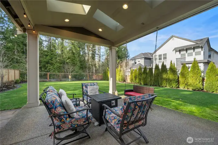 Beautiful covered patio with gas fire pit. Private backyard is adjacent to a protected natural preserve.
