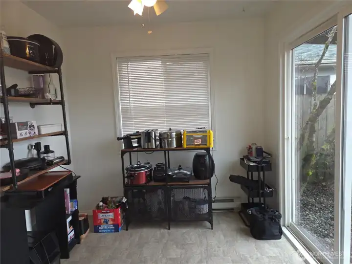 Small kitchenette or home office with slider to the patio.