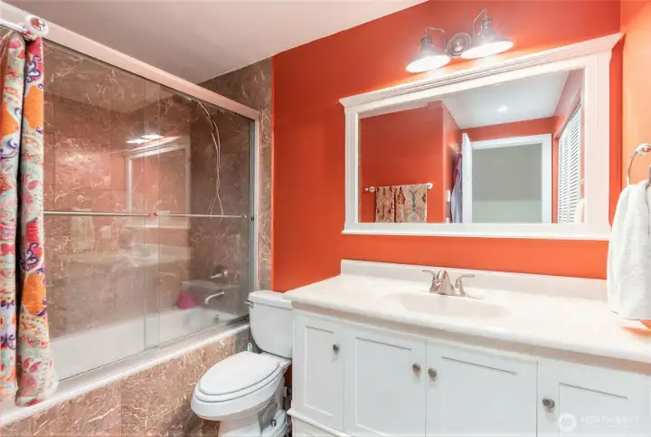 Full Bathroom with Vanity and side-by-side Laundry with Utility Closet