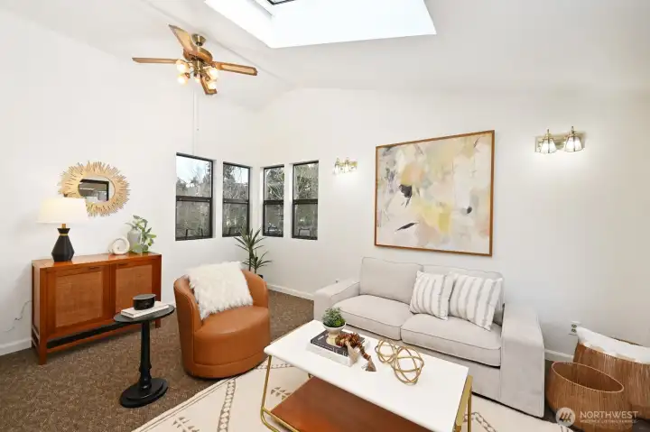 This room is just off the kitchen with vaulted ceiling and a skylight.  This space could be your "command center" for morning coffee, homework, and weekly planning.
