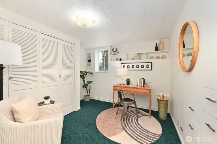 Lower level bedroom (non-conforming), complete with built in drawers and spacious closet;  could also be a fantasitic office.