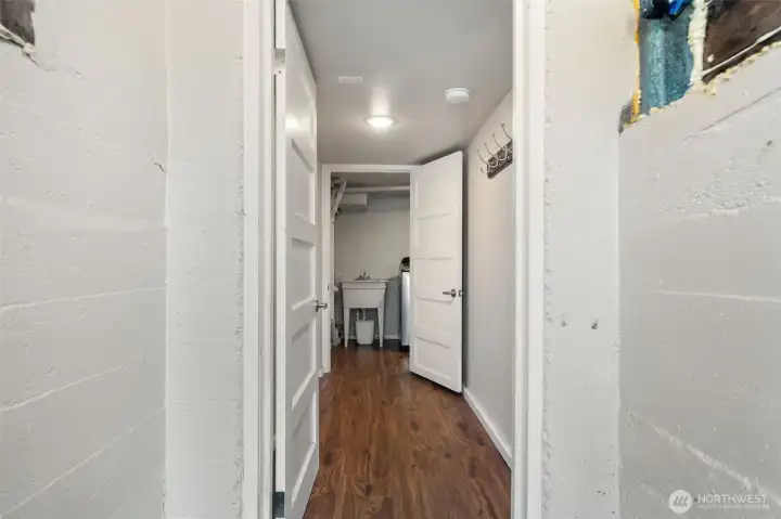 Basement entry for lower level, utility room straight ahead with utility sink, W & D, water heater and storage area for bicycles etc.