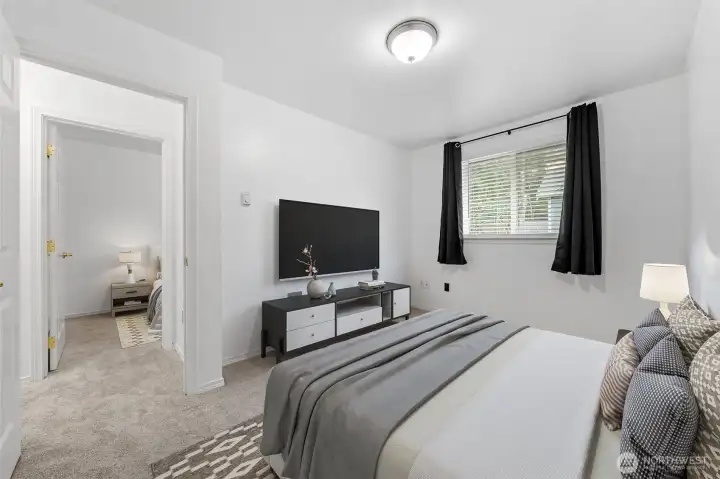 A 3rd carpeted bedroom adjoins the other upper level bedroom.