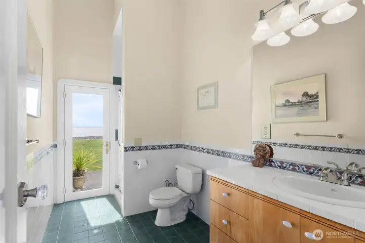 3/4 bath off the hallway that has a door that you can enter from the patio after a day of entertaining and enjoying the outdoors